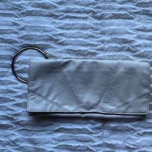 White/cream clutch cute for going out, put your hand through the ring for ease